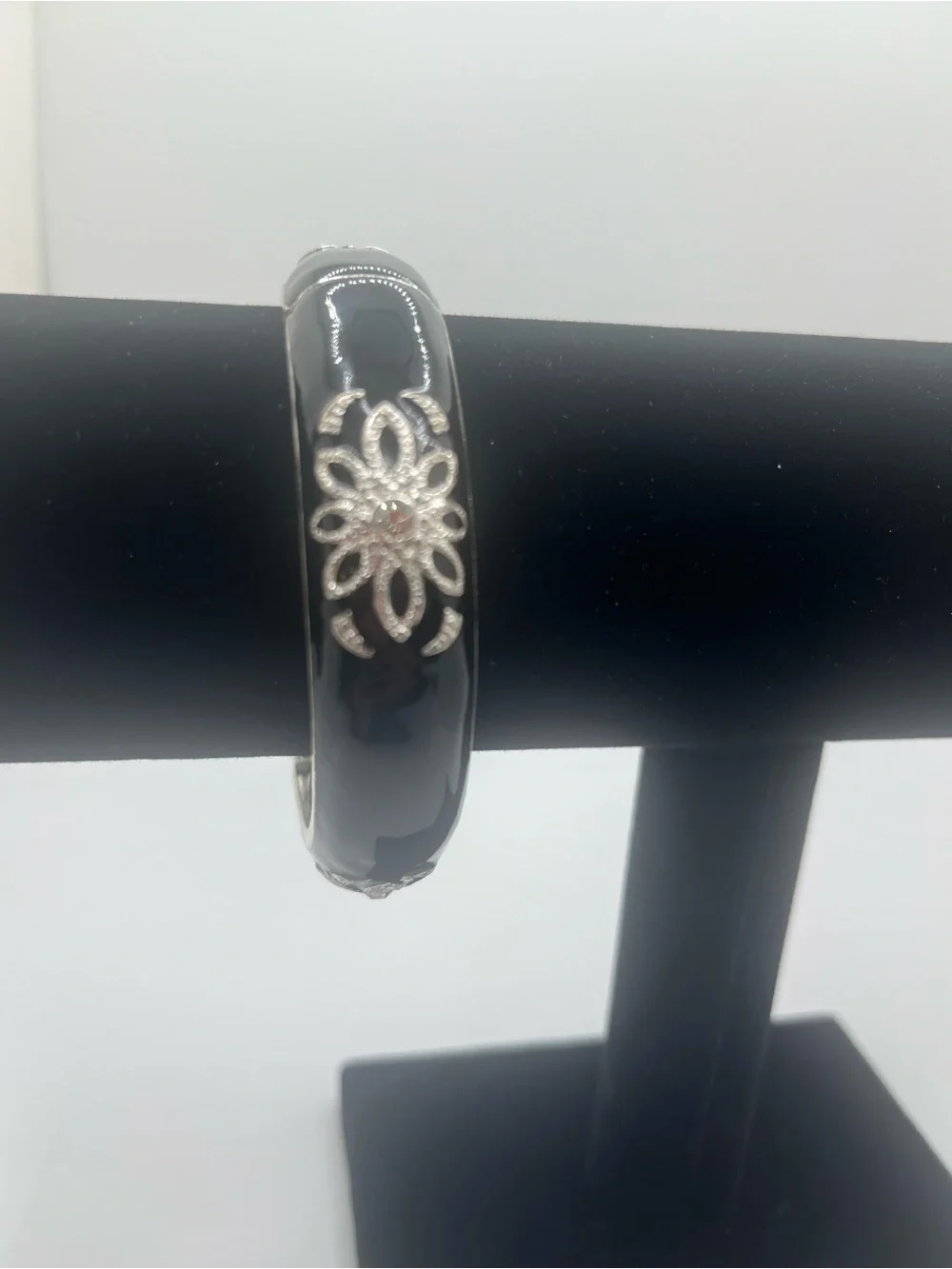 Black enamel hinged bangle bracelet silver tone floral rhinestone accents